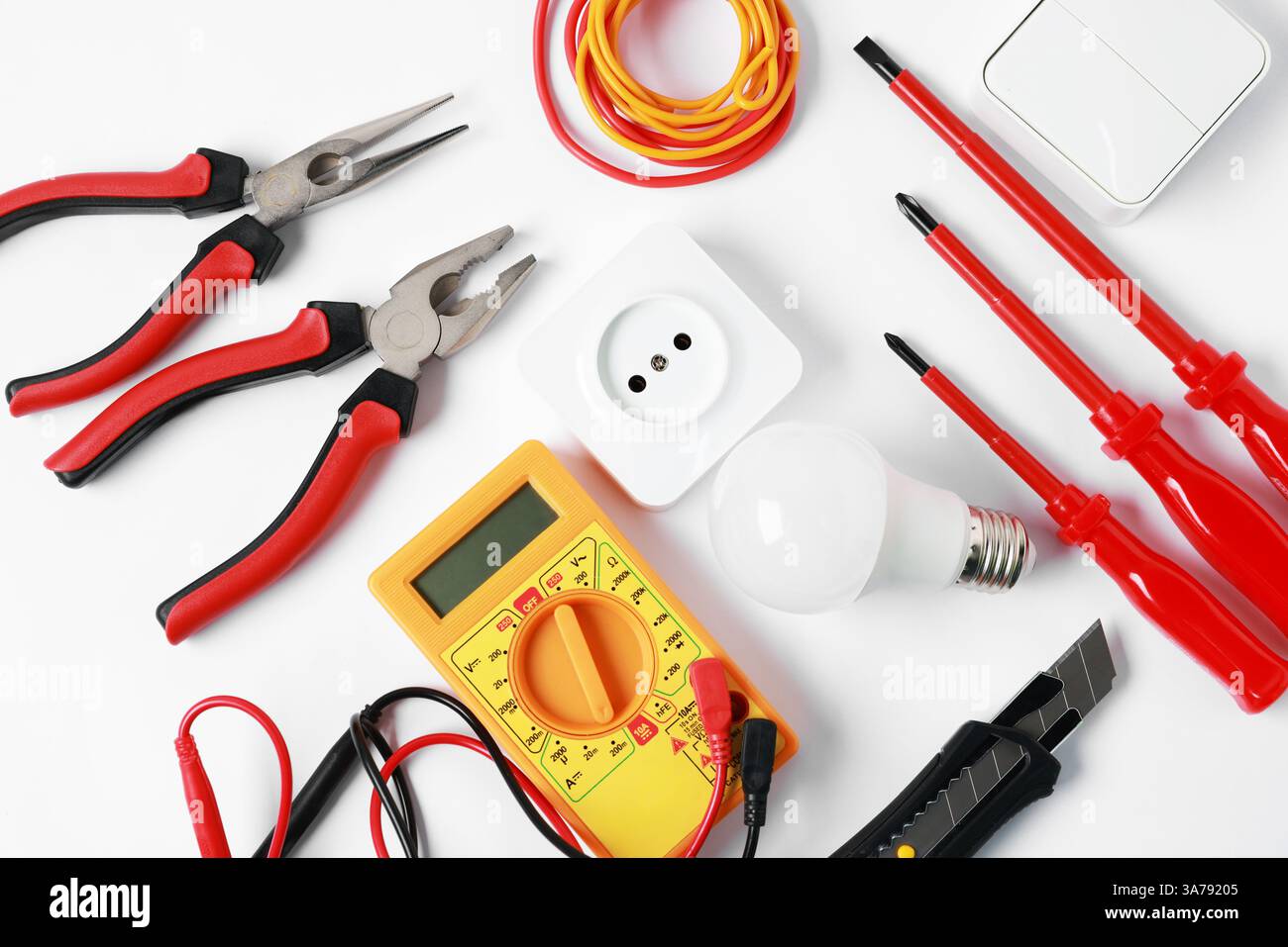 Different electrical tools on light background, flat lay Stock Photo