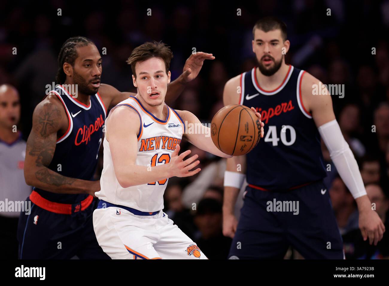 New York Knicks guard Tyler Kolek looks to pass the ball between LA ...