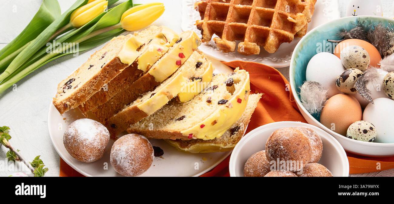 Variation of Easter dishes. Stylish Easter eggs in plate with sweets. Top view. Stock Photo