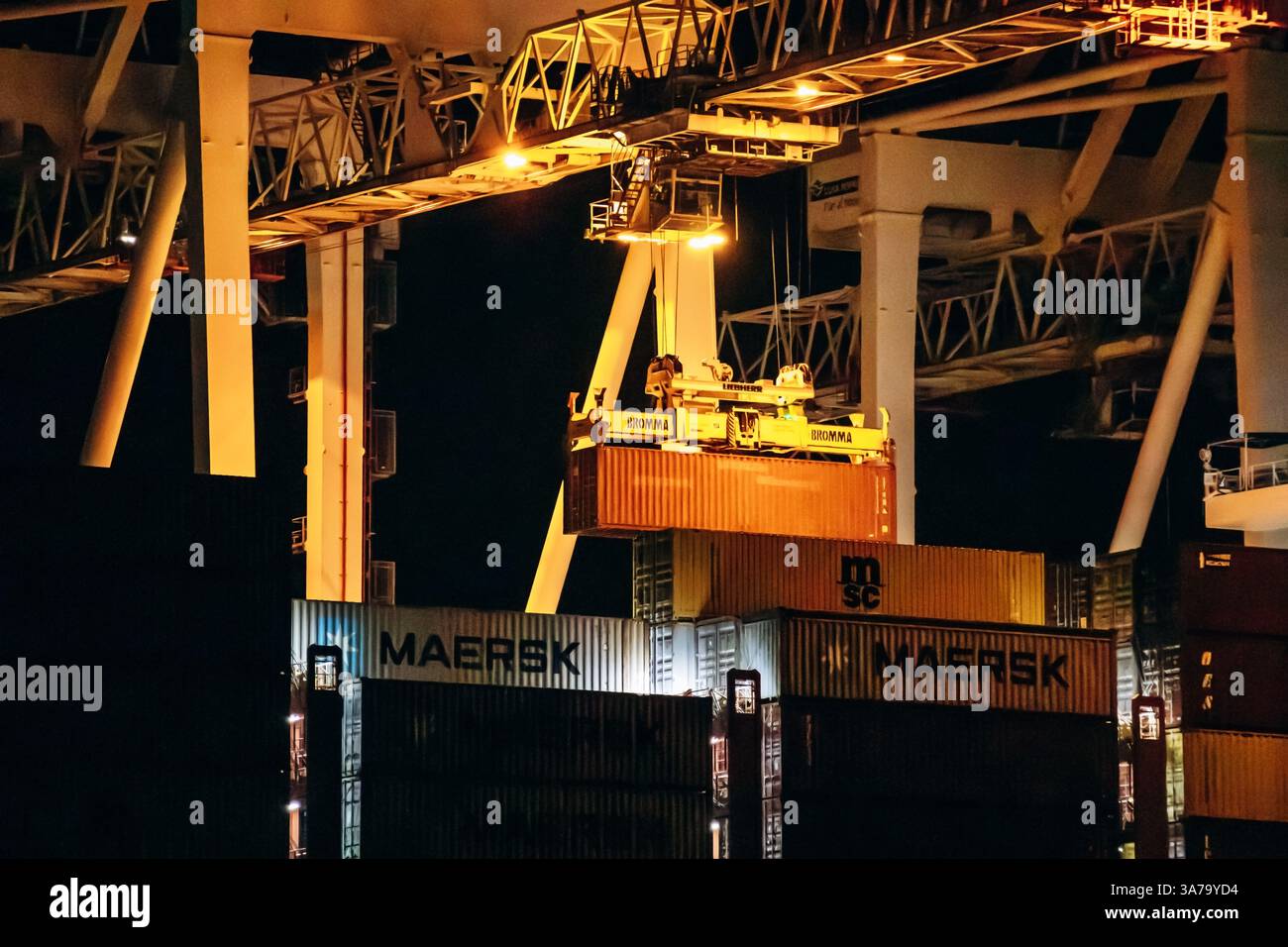 Lights Container Loading Koper, Slovenia - August 16, 2024: Nighttime cargo container loading in ...