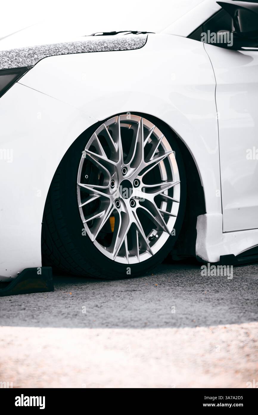 An elegant white luxury car with stylish silver alloy rims, ideal for ...