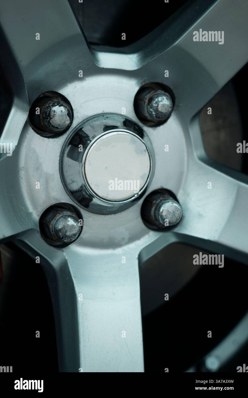 A close-up shot of a sleek alloy rim, showcasing its intricate design and premium finish. Perfect for luxury car branding and automotive ads Stock Photo