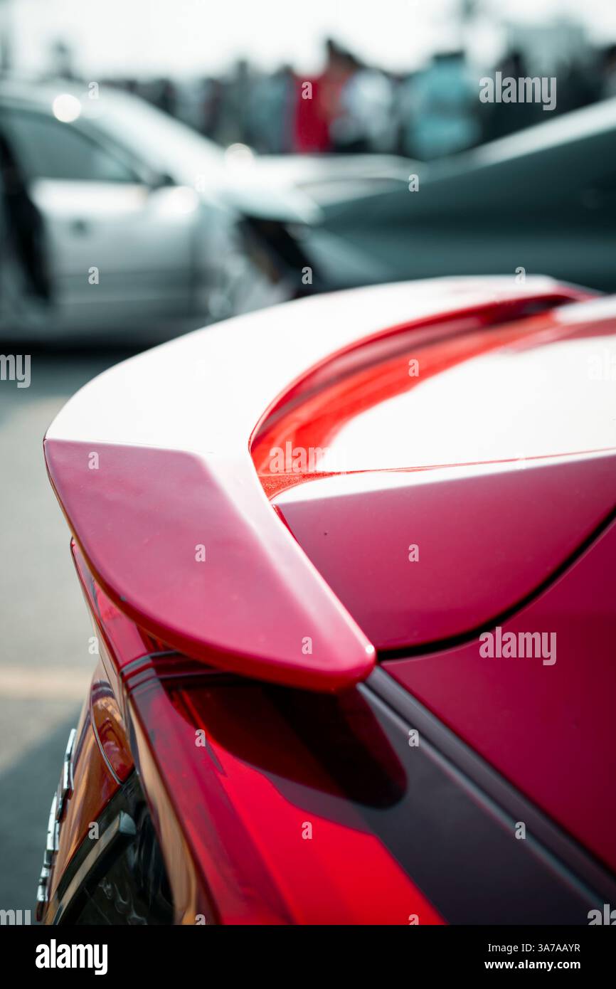 A dynamic red car spoiler designed for enhanced aerodynamics and speed. Perfect for automotive performance ads, racing content, or sports car enthusia Stock Photo