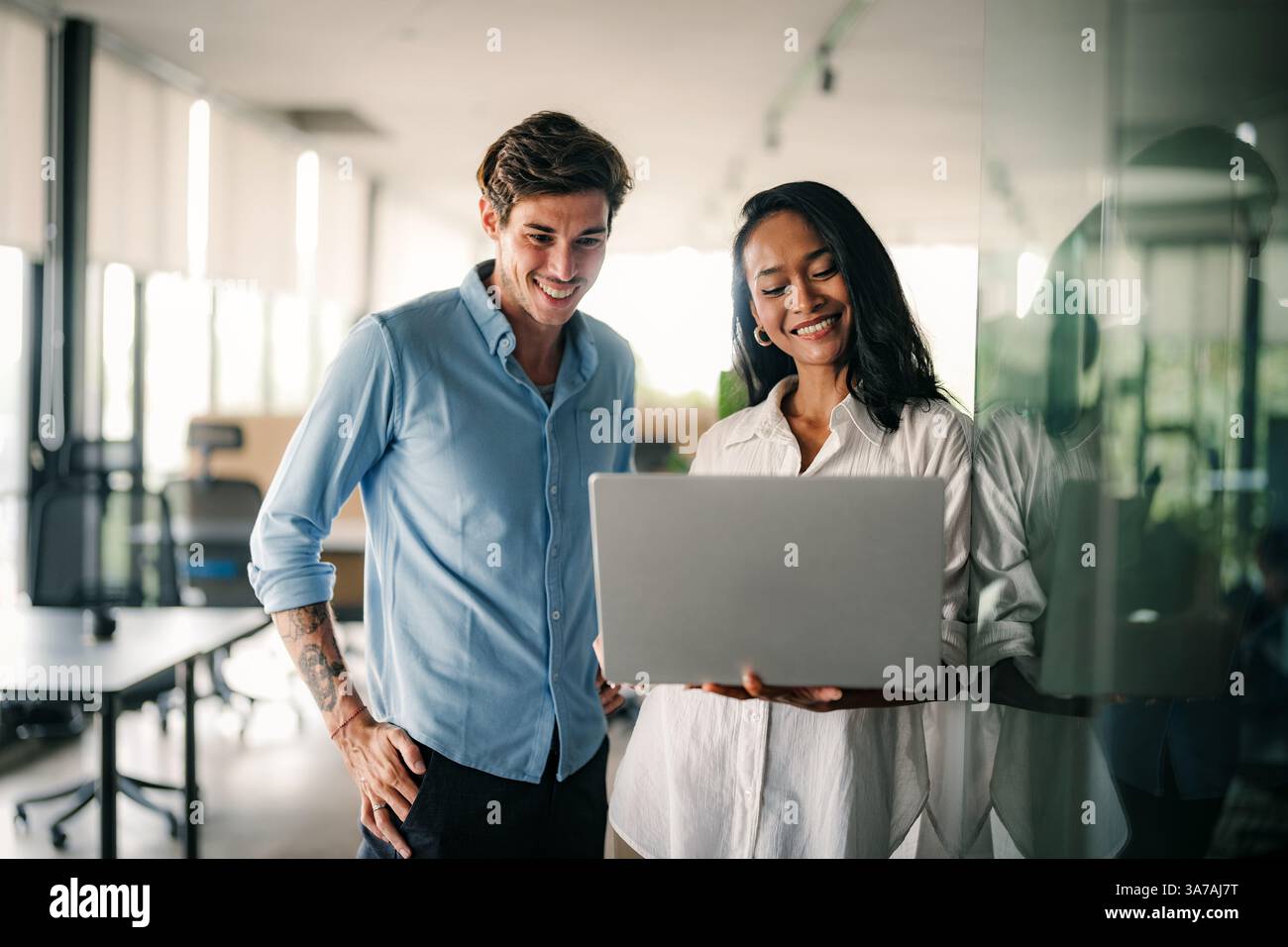 Mixed team of software engineers brainstorming ideas. Diverse app developers collaborating as group Stock Photo