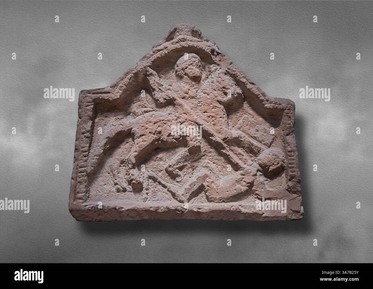 Upper register of a Roman military tombstone of s Roman cavalryman, depicting him impaling a fallen enemy.  2nd cent AD Kirkby Thore, Cumbria, England Stock Photo