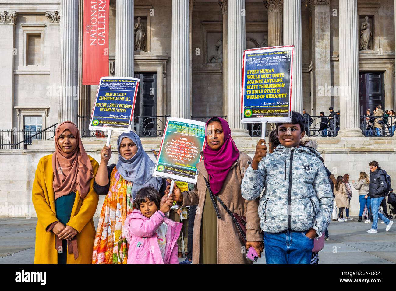 Activists holding protest signs during demonstration. London, UK, 5 November 2023 Stock Photo