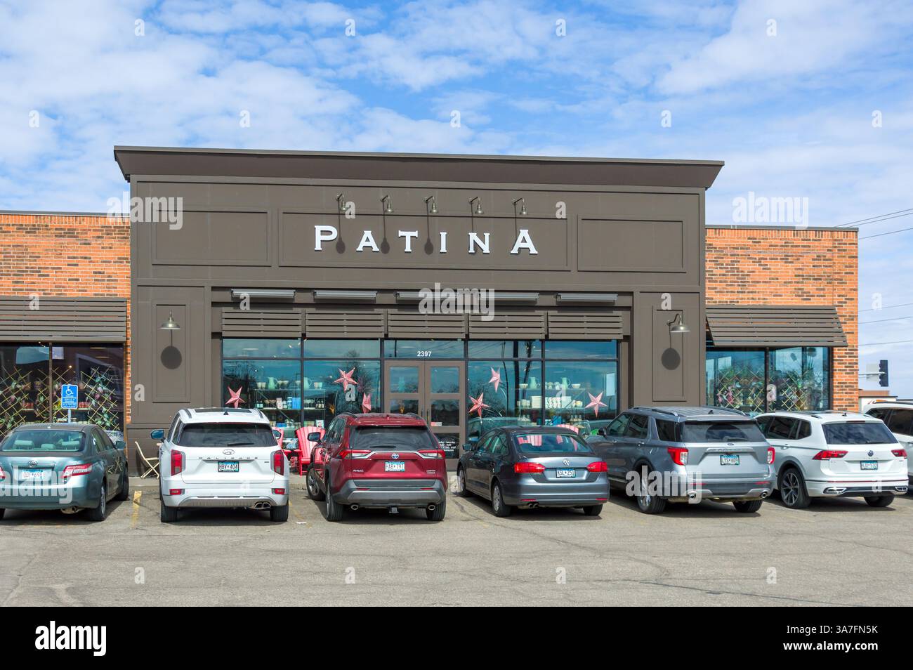 ST. PAUL, MN, USA, MARCH 22, 2025: Patina retail exterior and trademark logo. Stock Photo