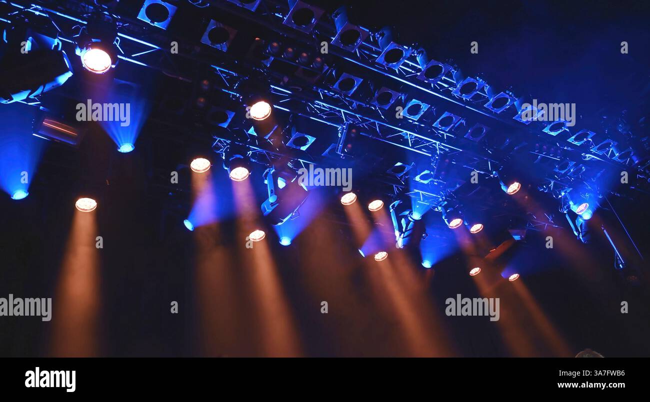 ceiling spotlights lights as a stage from above during the concert or show Stock Photo