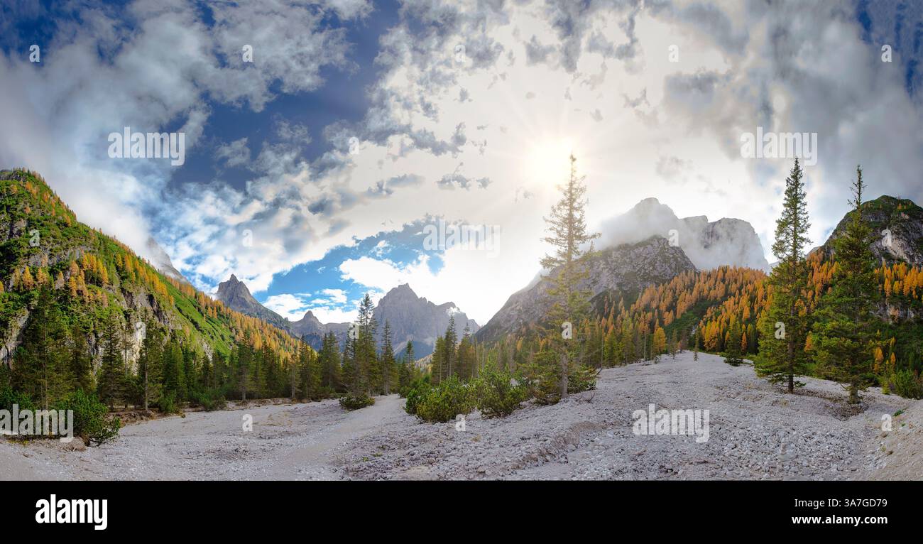 The Innerfeldtal with Mount Morgenkopf shrouded in clearing clouds, Innichen,  , Italy, landscape, forest, wood, trees, autumn, mountains, hills, Dolo Stock Photo