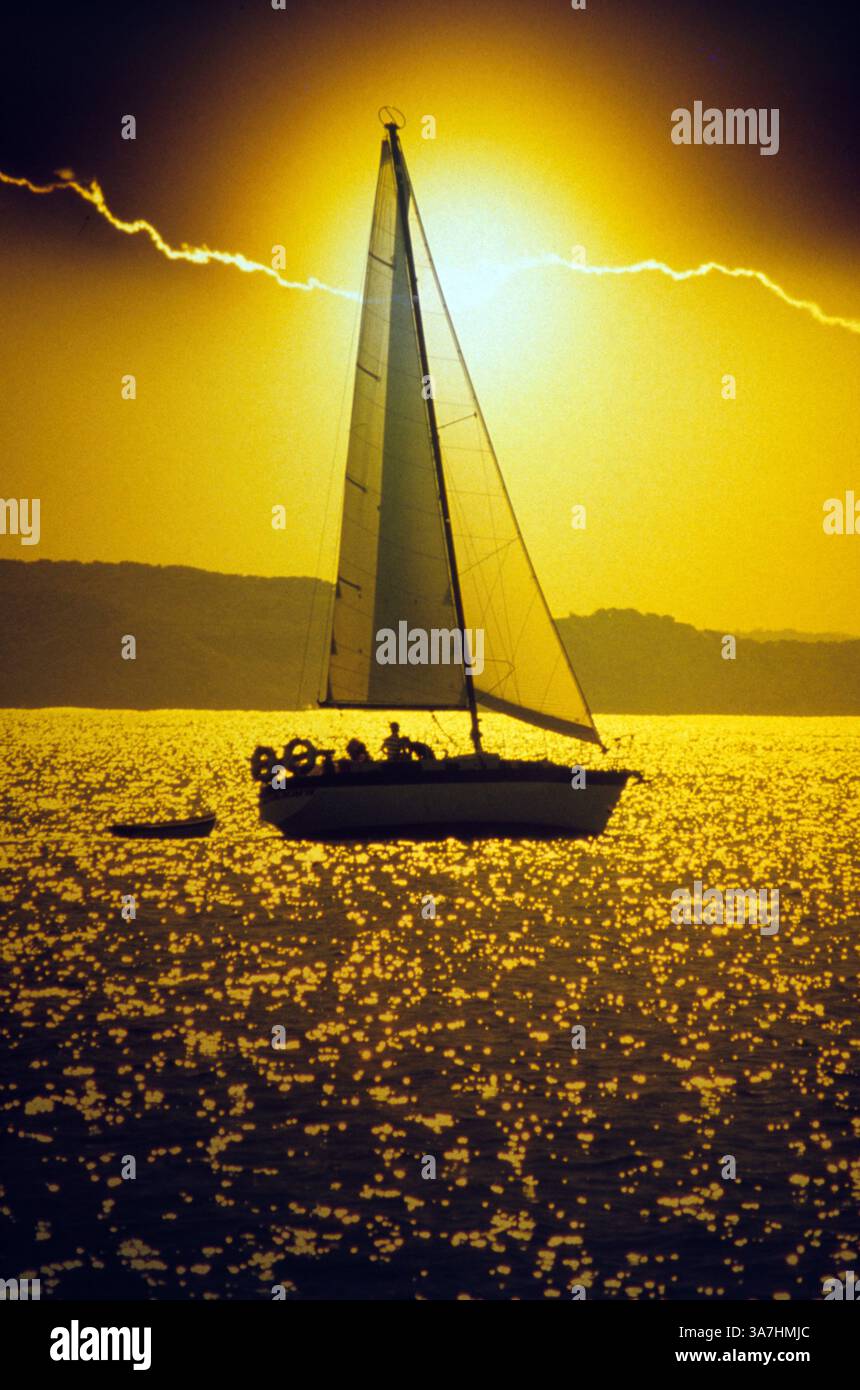 Sailing boat at sunset hi-res stock photography and images - Alamy
