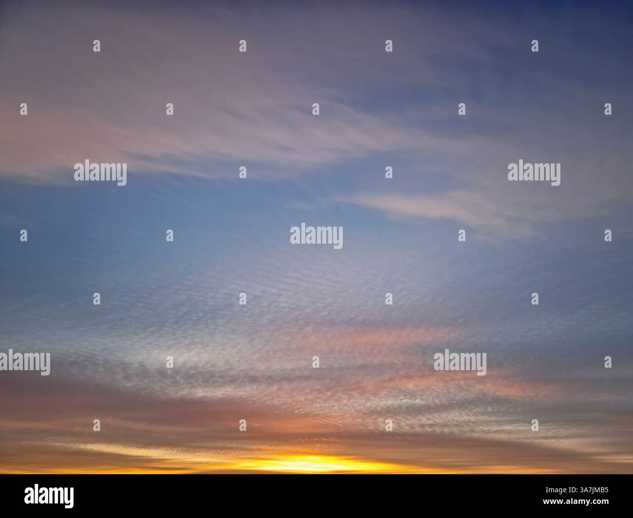 Beautiful winter sunset sky background. Colorful dusk clouds - Smartphone Captured Stock Image