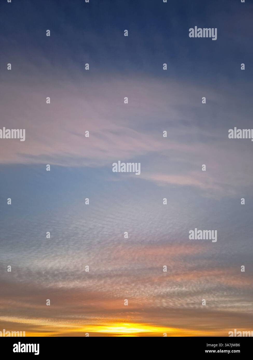 Beautiful winter sunset sky background. Colorful dusk clouds - Smartphone Captured Stock Image