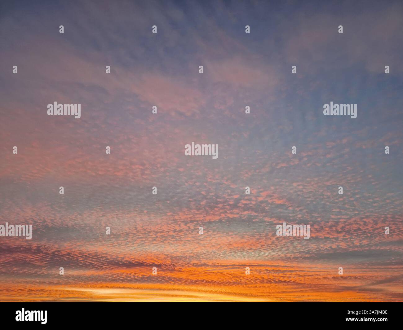 Wonderful winter sunset background. Colorful sundown clouds texture - Smartphone Captured Stock Image