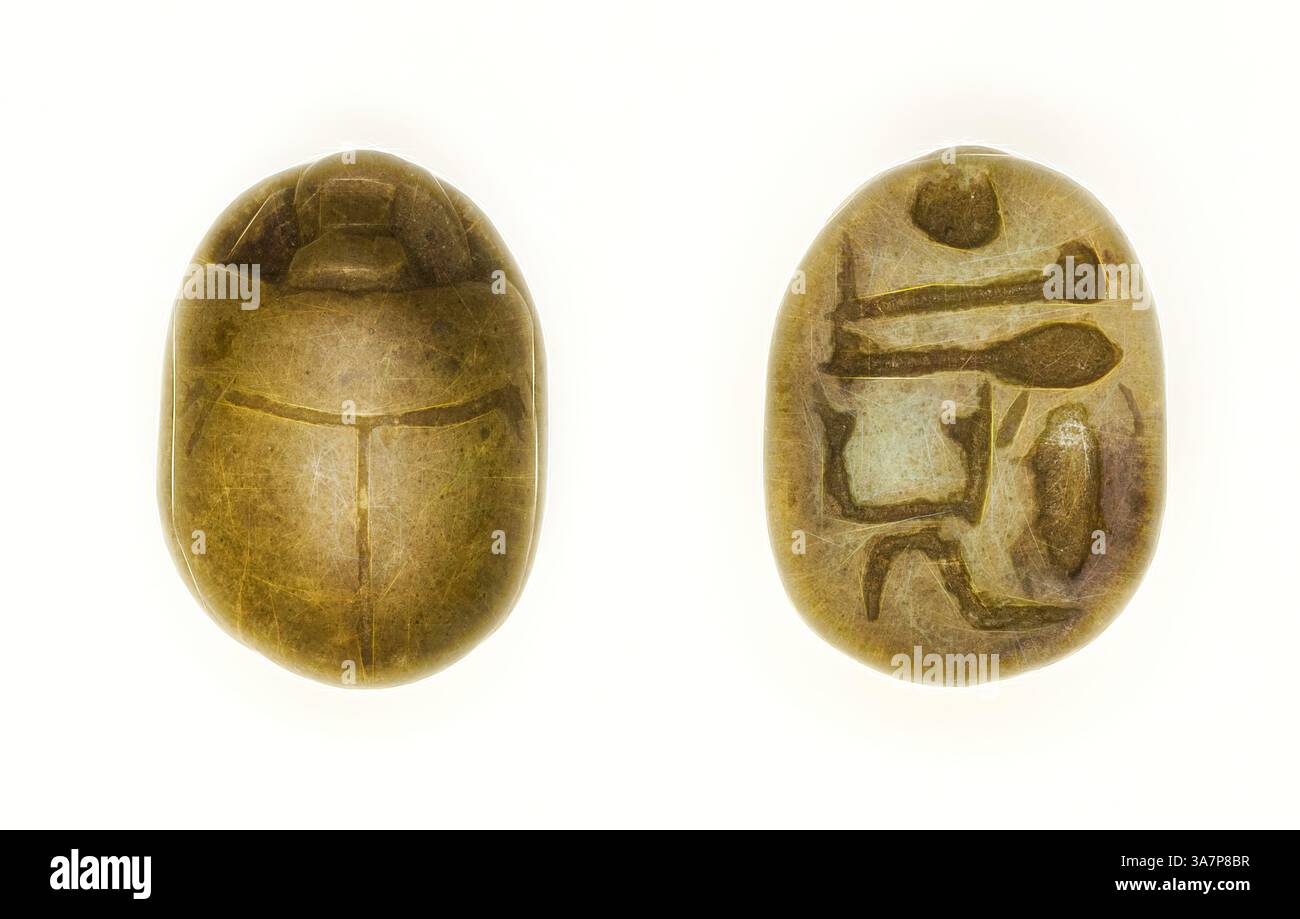 Two intricately carved scarab amulets, featuring detailed designs on ...