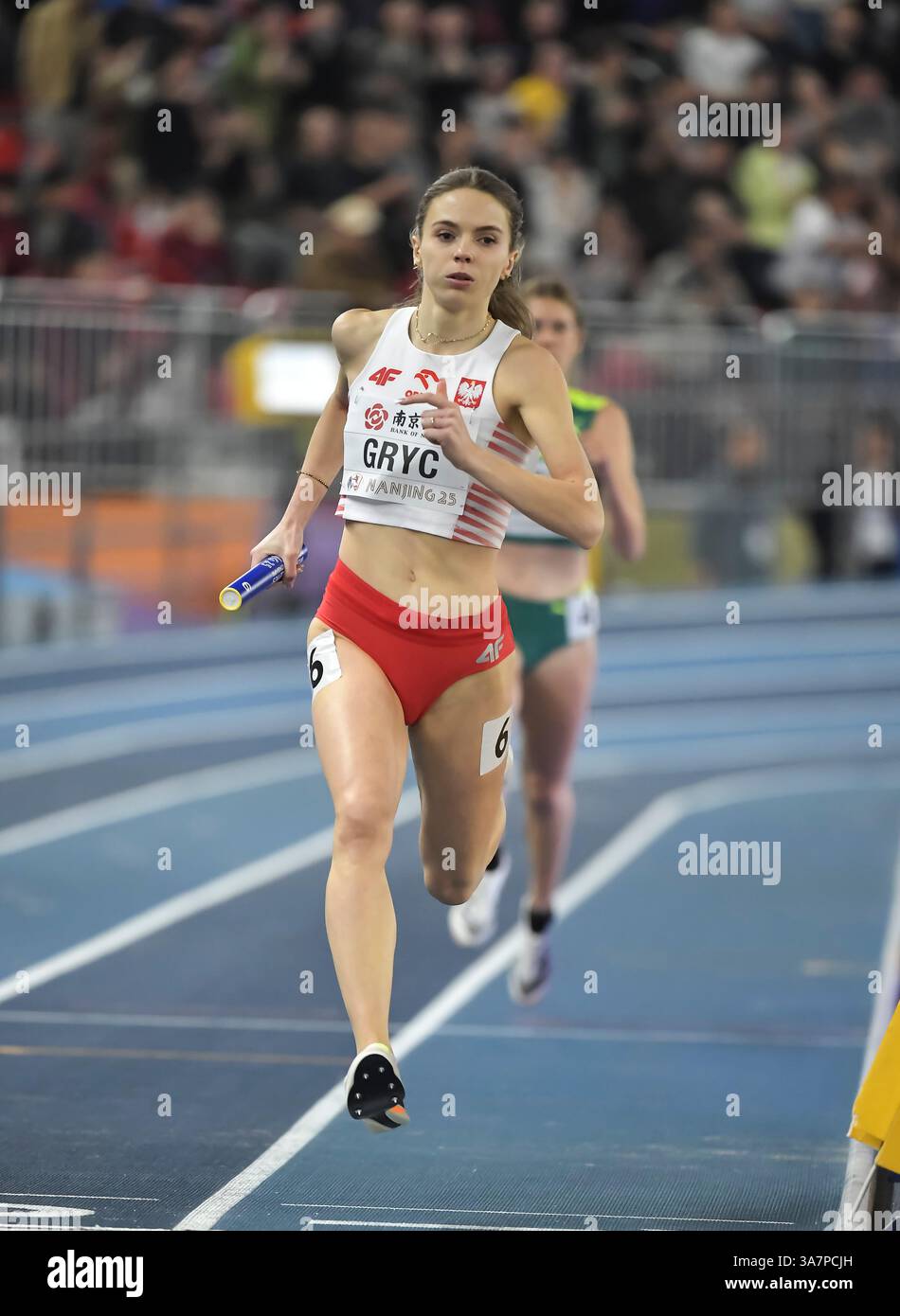 Anna Gryc of Poland competing in the women’s 4x400m relay change over