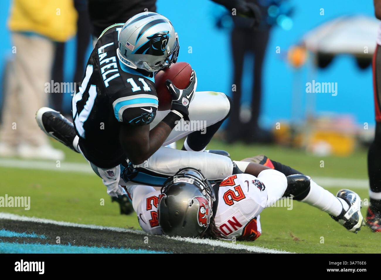 November 18, 2012; Carolina Panthers wide receiver Brandon LaFell (11) scores despite the efforts of Tampa Bay Buccaneers strong safety Mark Barron (24) at Bank of America Stadium in Charlotte,NC.  Panthers lose in overtime to Tampa Bay 27-21.(Credit Image: © Jim Dedmon/Cal Sport Media/ZUMAPRESS.com) Stock Photo