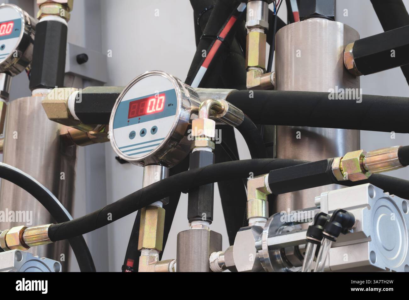 A digital pressure gauge is attached to a pipe Stock Photo - Alamy