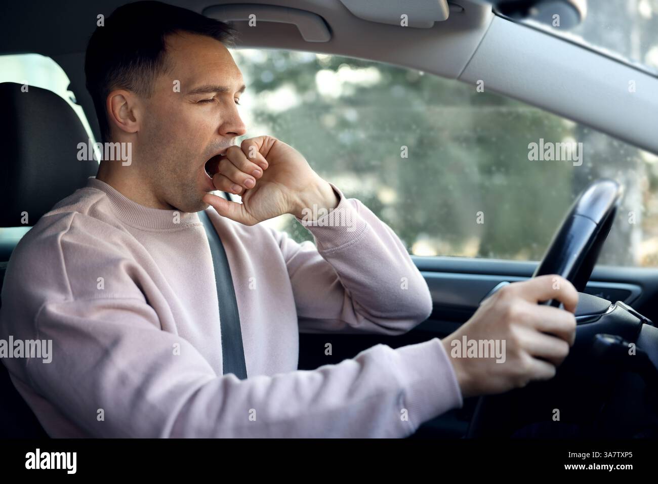 Sleepy driver yawning in his modern car Stock Photo - Alamy
