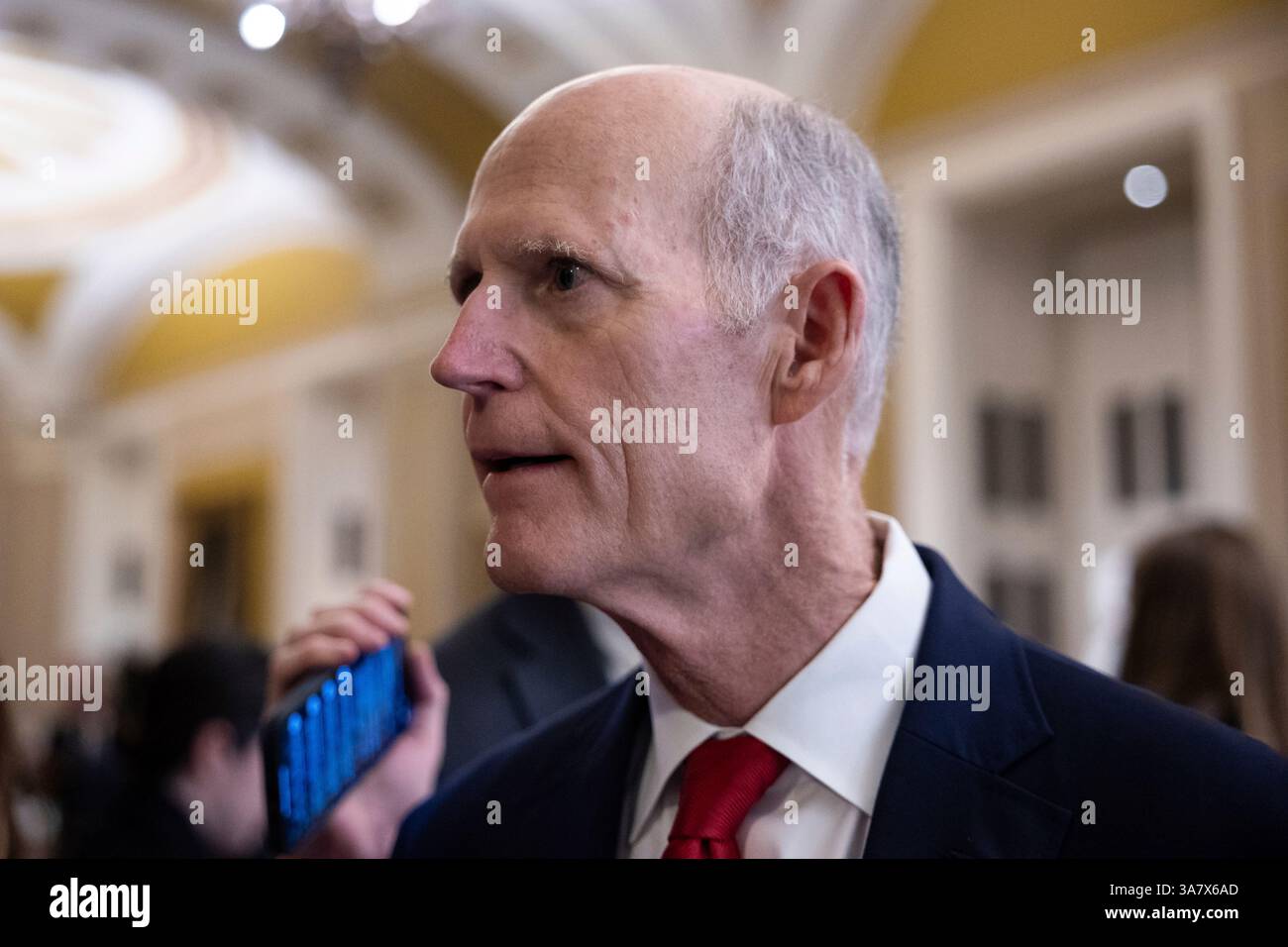 Sen. Rick Scott (R-Fla.) speaks with reporters on his way to a vote at ...