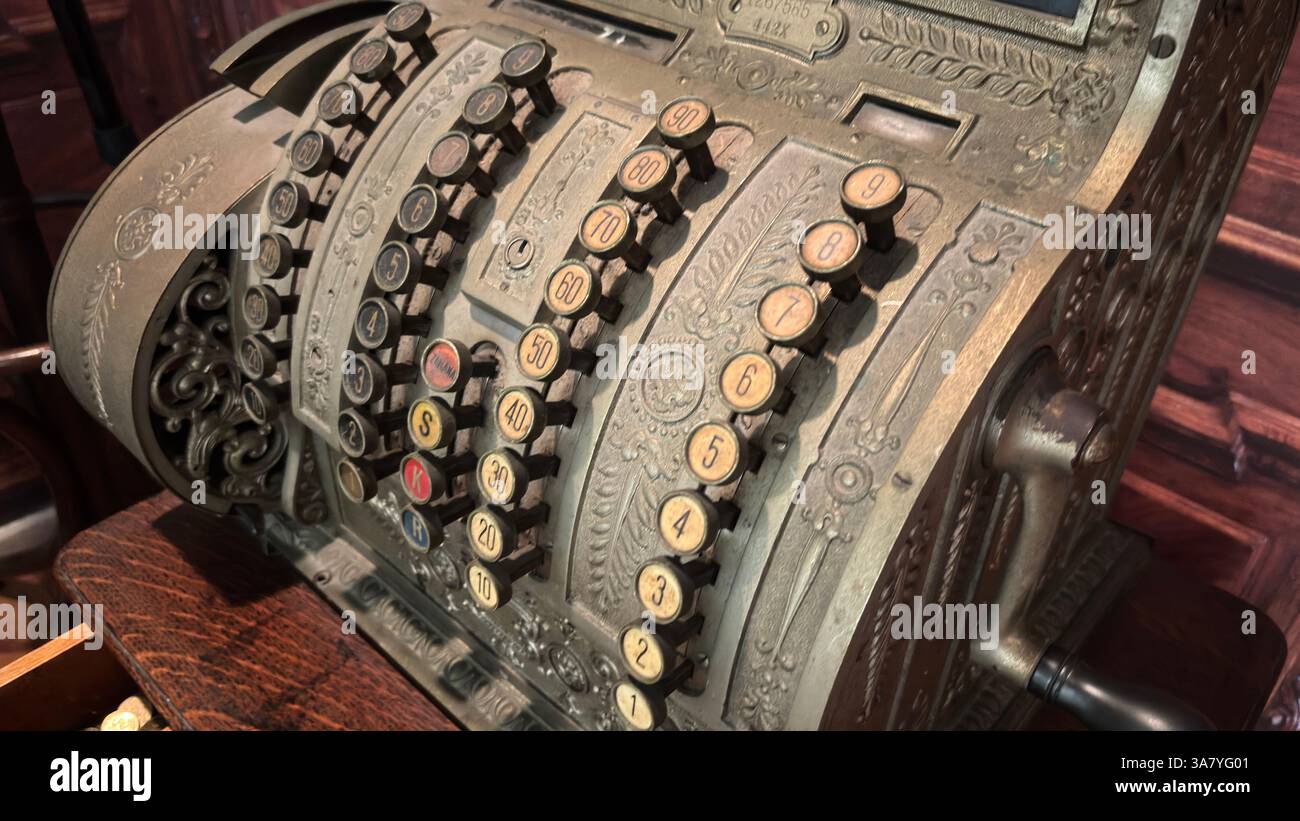 Vintage old retro metal cash register coin machine with buttons and ...
