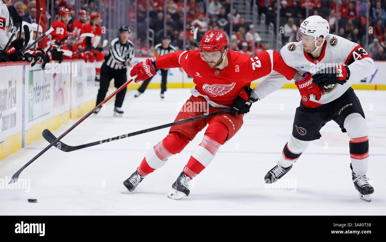 Detroit Red Wings center Michael Rasmussen (27) moves the puck against ...