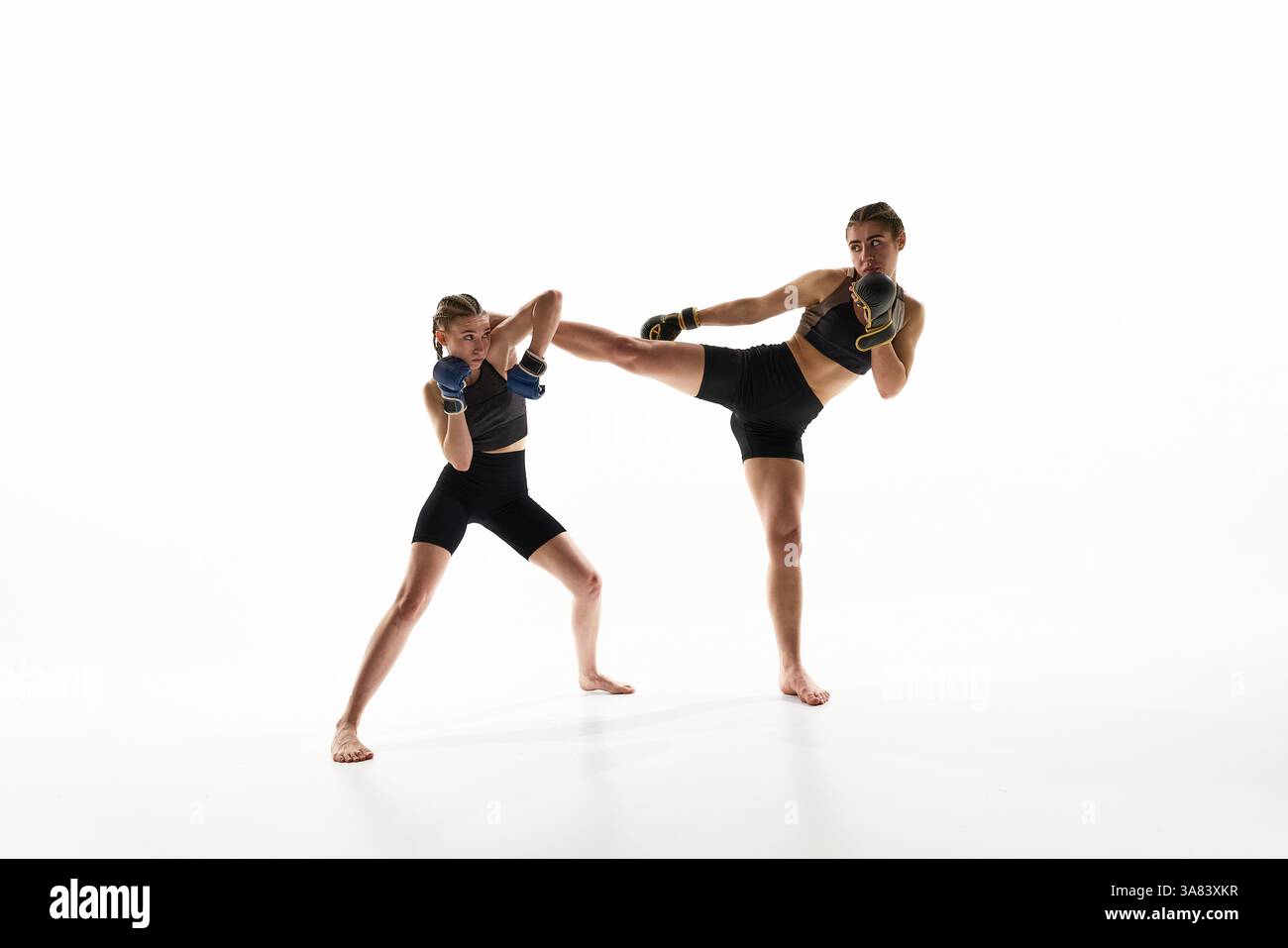 Dynamic image of two competitive and strong women in sportswear and ...