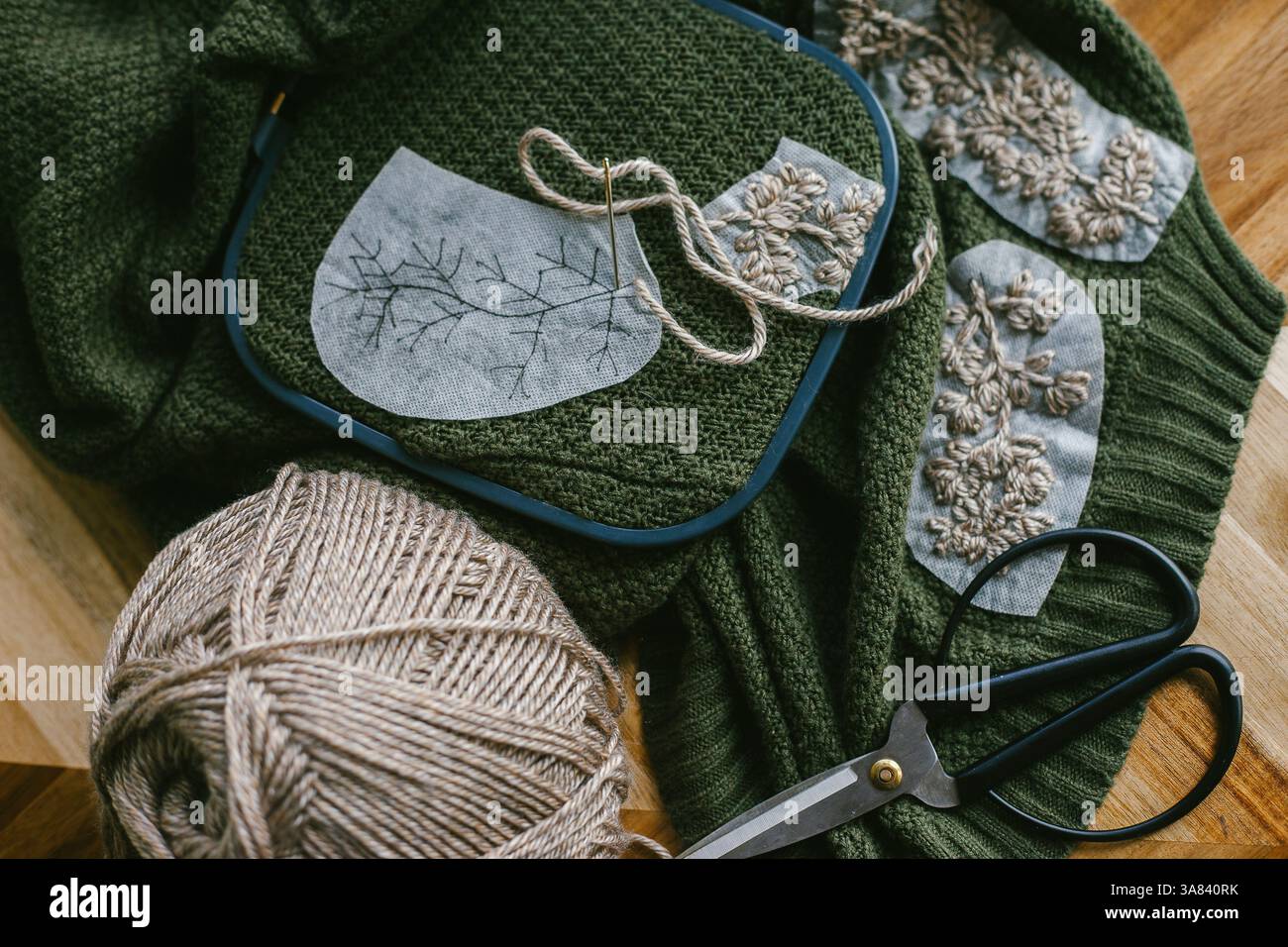 Embroidery Work in Progress on a Green Sweater Stock Photo