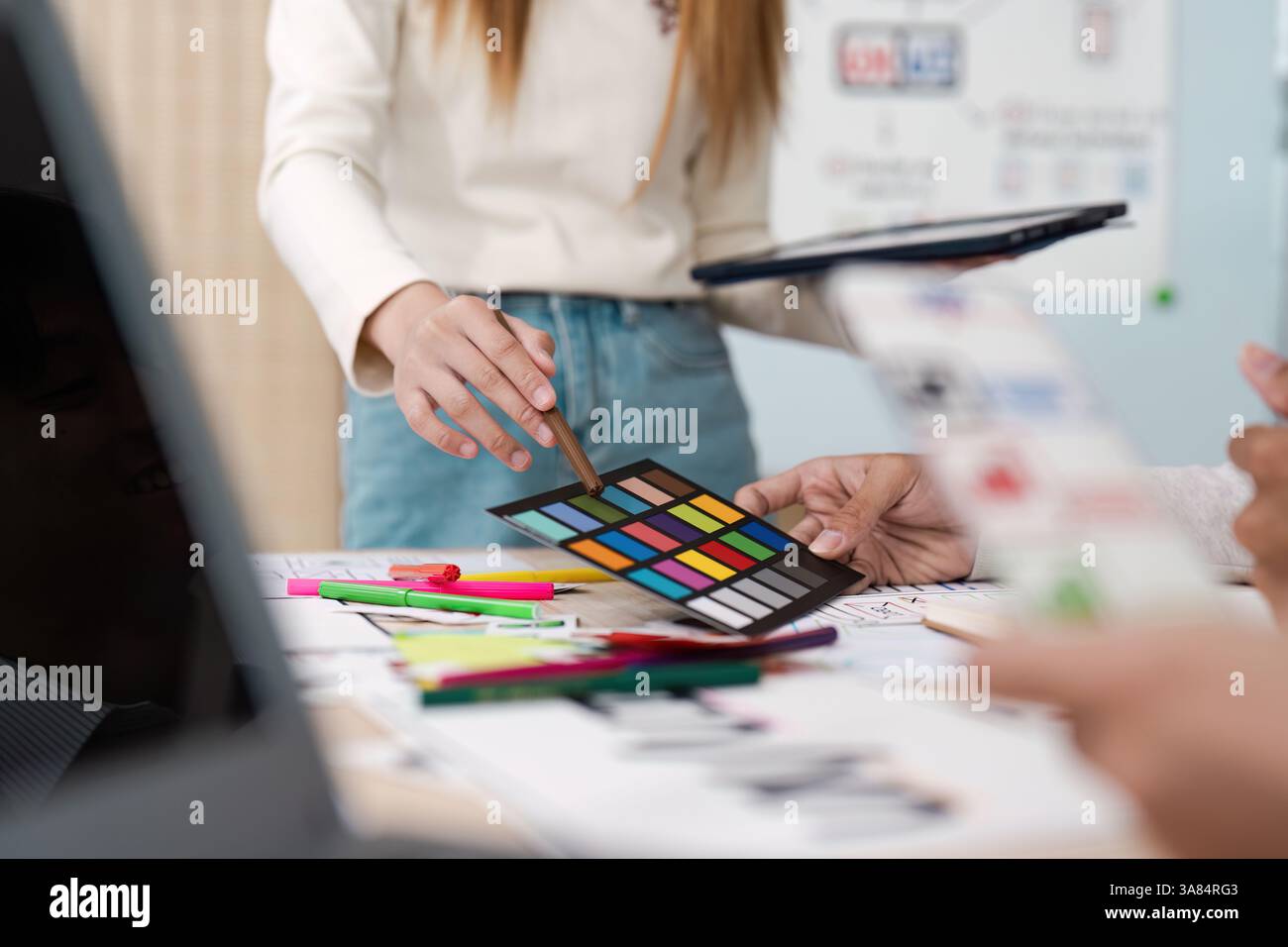 Creative Collaboration and Color Theory. Team members brainstorming ...