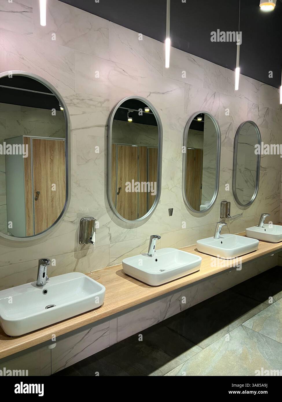 Modern restroom interior with stone gray tiles. interior of public ...