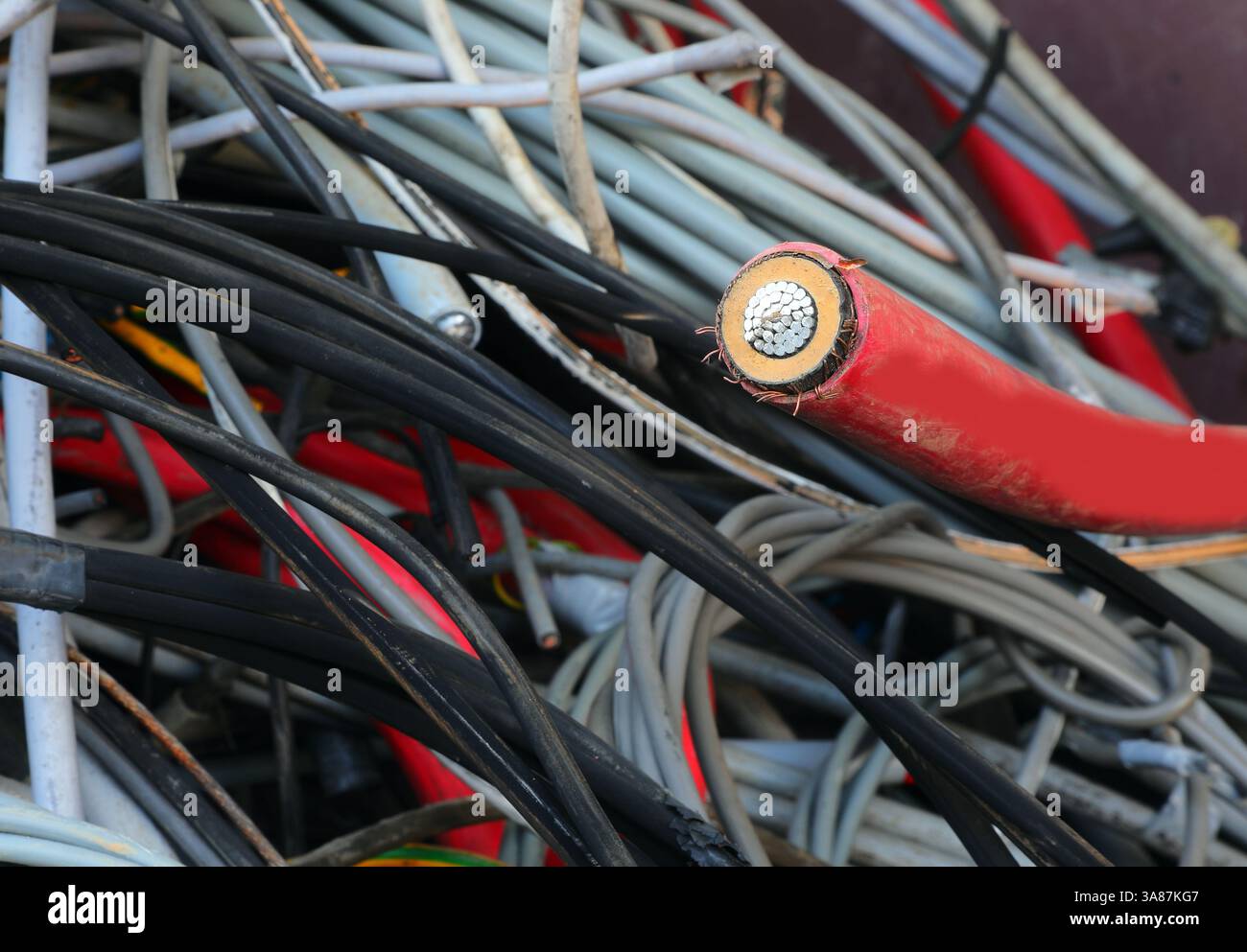 detail of the section of an electric cable and other used cables in the ...