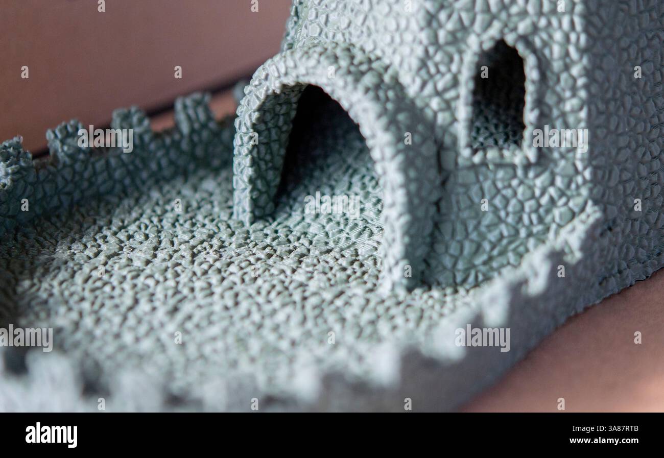 Small object created from molten plastic on 3D printer. Three-dimensional model printed on 3D printer from plastic. Modern new 3d printing technology. FDM technology. Additive progressive technologies Stock Photo