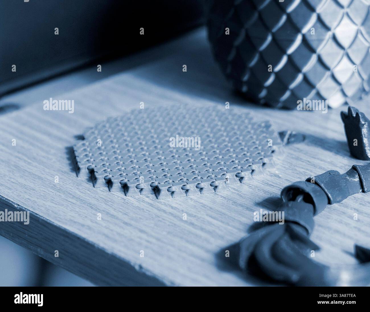 Small object created from molten plastic on 3D printer. Three-dimensional model printed on 3D printer from plastic. Modern new 3d printing technology. FDM technology. Additive progressive technologies Stock Photo