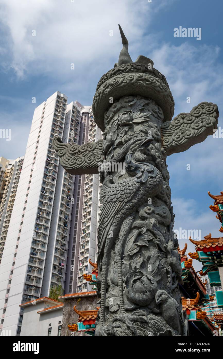 Hong Kong. China- 02.24.2025. An imposing Chinese totem pole carved with a phoenix motif in Sik Sik Yuen Wong Tai Sin Temple podium. Stock Photo