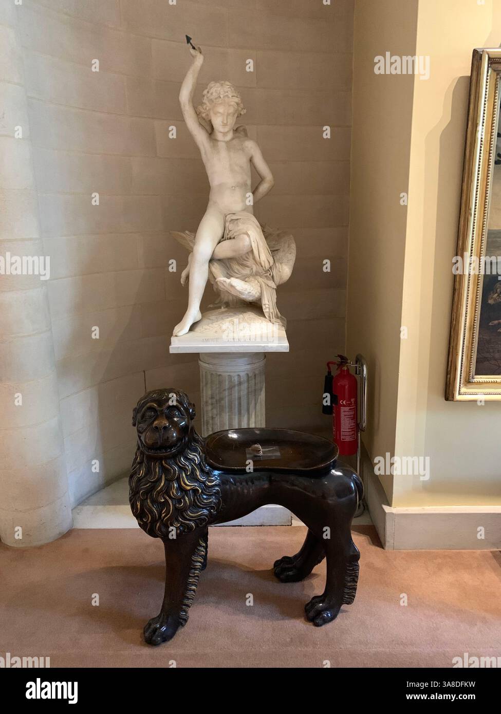 Anglesey Abbey Cambridgeshire UK England hall dog lights stand pictures carpets carpet decorations library Mary Queen of Scots Henry the eighth - Smartphone Captured Stock Image