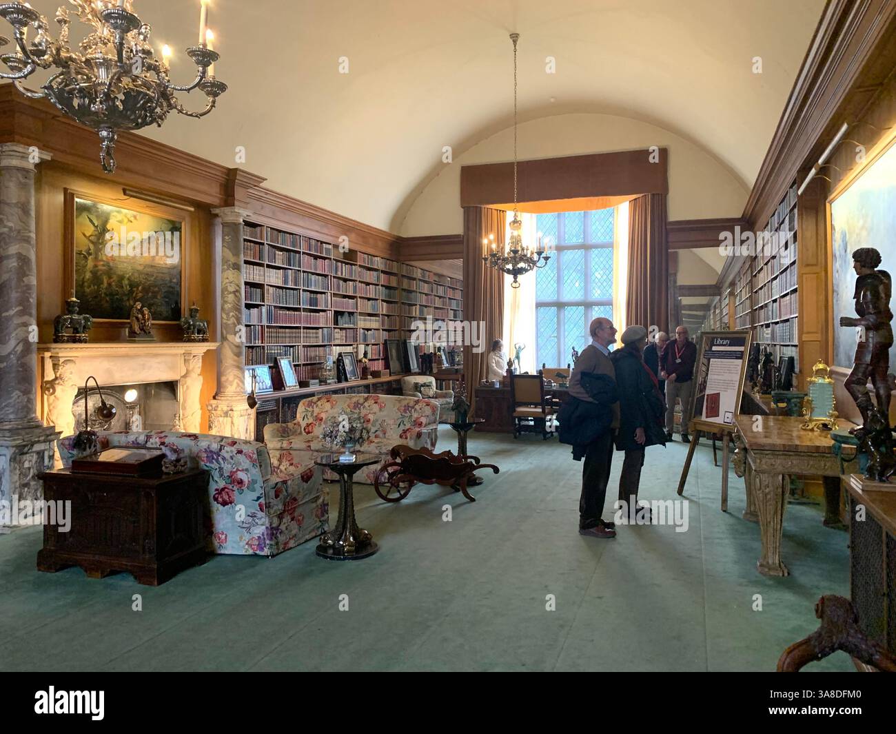 Anglesey Abbey Cambridgeshire UK England hall dog lights stand pictures carpets carpet decorations library Mary Queen of Scots Henry the eighth - Smartphone Captured Stock Image