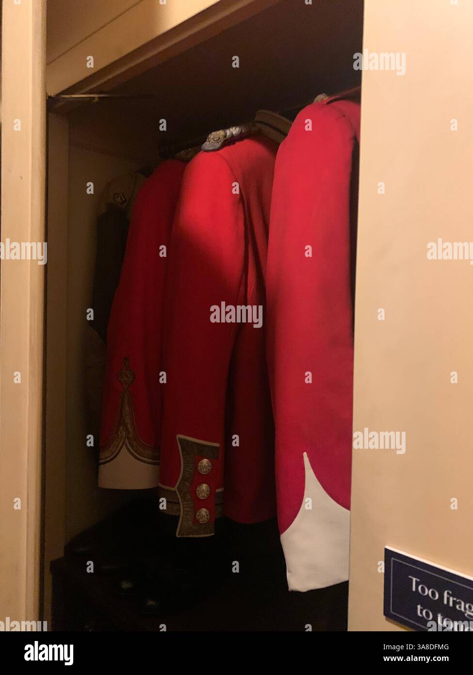 Anglesey Abbey Cambridgeshire UK England coats in  lights stand pictures carpets carpet decorations library Mary Queen of Scots Henry the eighth - Smartphone Captured Stock Image