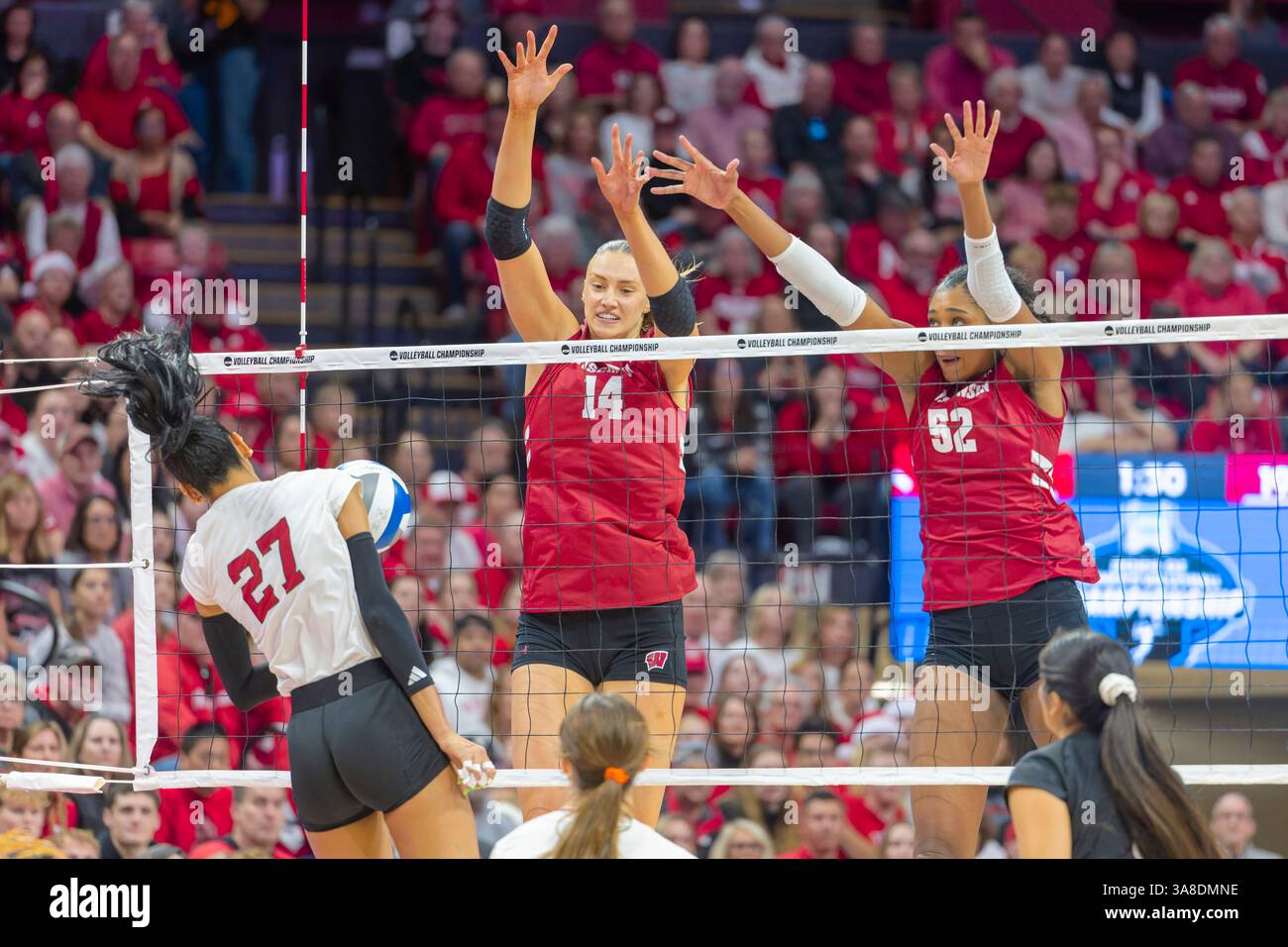 LINCOLN, NE - DECEMBER 15: Wisconsin's Anna Smrek (14) and Carter Booth ...