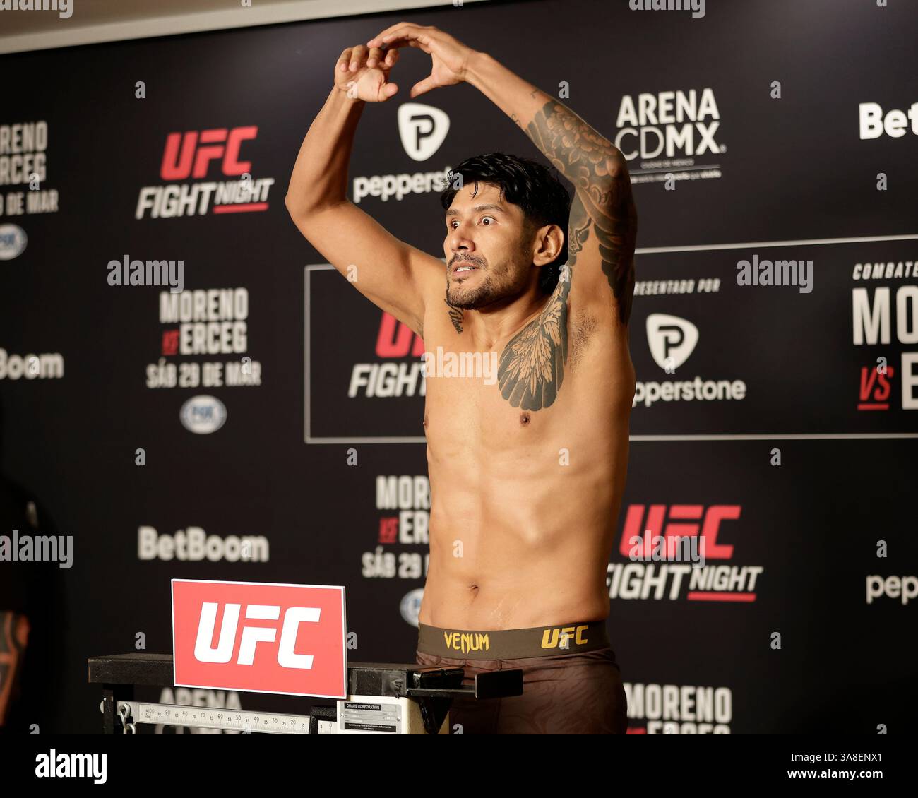 Mexico City, Mexico, MEX. 28th Mar, 2025. poses on the scale during official weigh-ins for UFC Fight Night Mexico City at the InternContinental Mexico City hotel in Mexico City, MX. (Credit Image: © Alejandro Salazar/ZUMA Press Wire) EDITORIAL USAGE ONLY! Not for Commercial USAGE! Stock Photo
