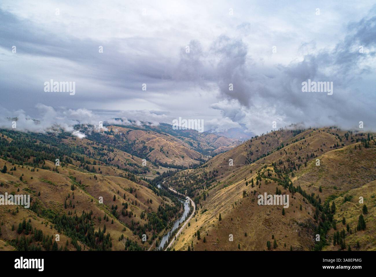The sky is cloudy and the mountains are brown Stock Photo