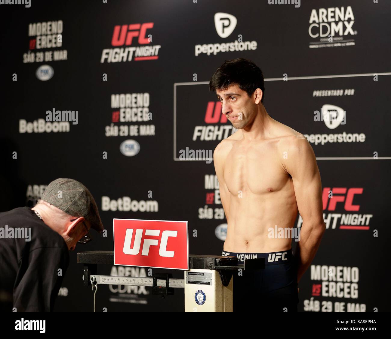 Mexico City, Mexico, MEX. 28th Mar, 2025. poses on the scale during official weigh-ins for UFC Fight Night Mexico City at the InternContinental Mexico City hotel in Mexico City, MX. (Credit Image: © Alejandro Salazar/ZUMA Press Wire) EDITORIAL USAGE ONLY! Not for Commercial USAGE! Stock Photo