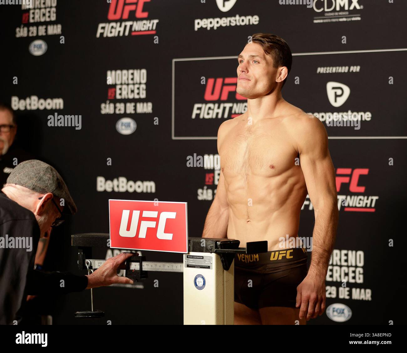 Mexico City, Mexico, MEX. 28th Mar, 2025. poses on the scale during official weigh-ins for UFC Fight Night Mexico City at the InternContinental Mexico City hotel in Mexico City, MX. (Credit Image: © Alejandro Salazar/ZUMA Press Wire) EDITORIAL USAGE ONLY! Not for Commercial USAGE! Stock Photo