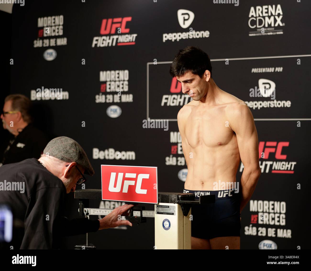 Mexico City, Mexico, MEX. 28th Mar, 2025. poses on the scale during official weigh-ins for UFC Fight Night Mexico City at the InternContinental Mexico City hotel in Mexico City, MX. (Credit Image: © Alejandro Salazar/ZUMA Press Wire) EDITORIAL USAGE ONLY! Not for Commercial USAGE! Stock Photo