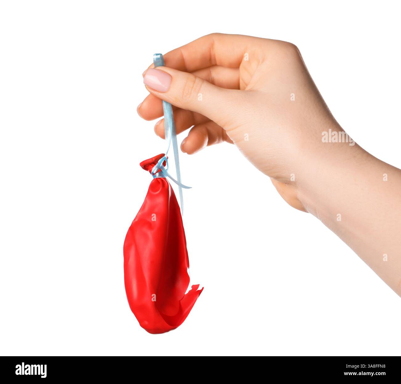 Woman holding popped red balloon on white background, closeup Stock Photo