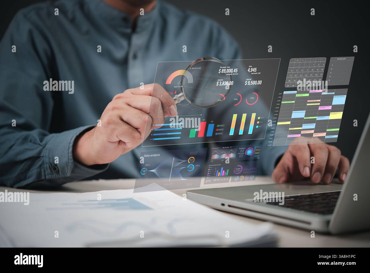 Business data dashboard, using laptop and magnifying glass to analyze charts, reports, and statistics for digital marketing and finance. AI analytics, Stock Photo