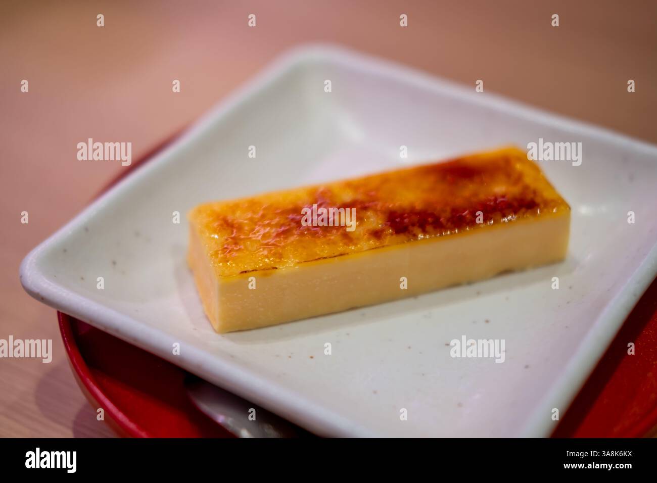 Catalana ice brulee, or a custard topped with a layer of caramelized sugar, similar to the French Creme Brulee Stock Photo