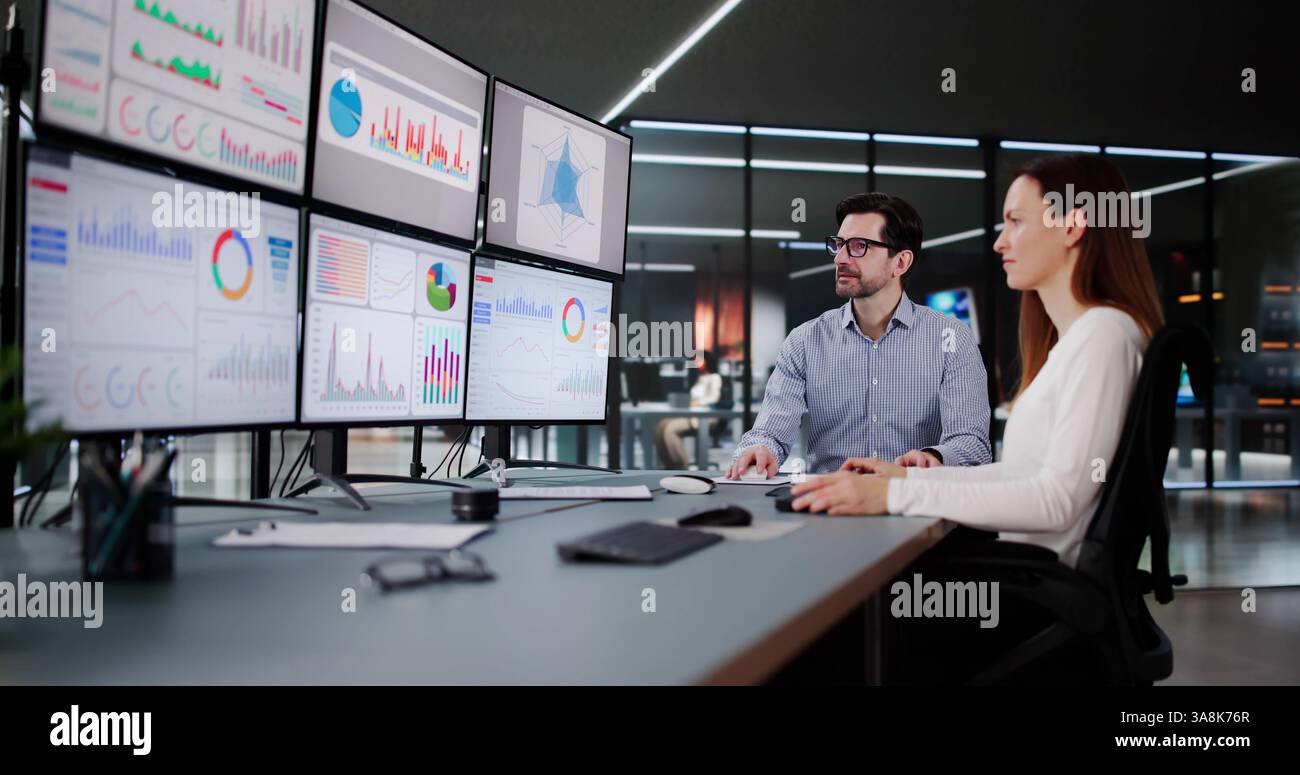 Financial Advisor Analyzing Stock Market Data on Desktop Computer Screen. Stock Photo