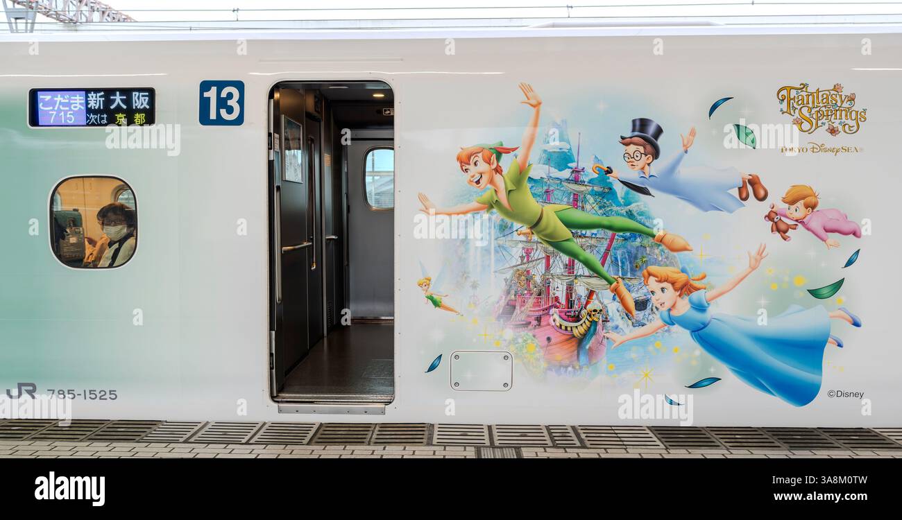 A JR Central N700 Series Shinkansen train at Maibara Station with graphics promoting Disney's Fantasy Springs attraction at Tokyo DisneySea with chara Stock Photo