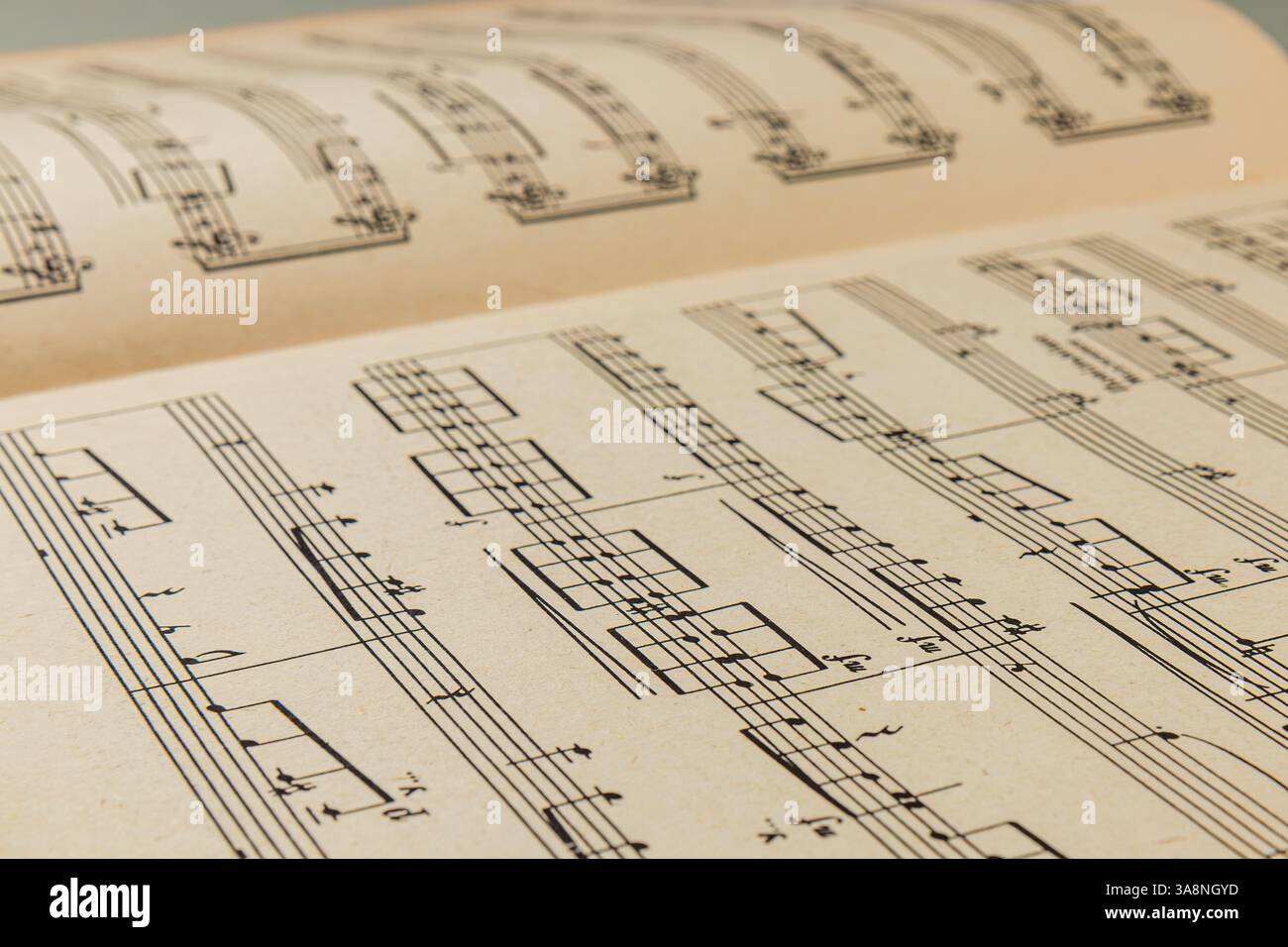 A vintage musical score open to a page filled with detailed notations ...