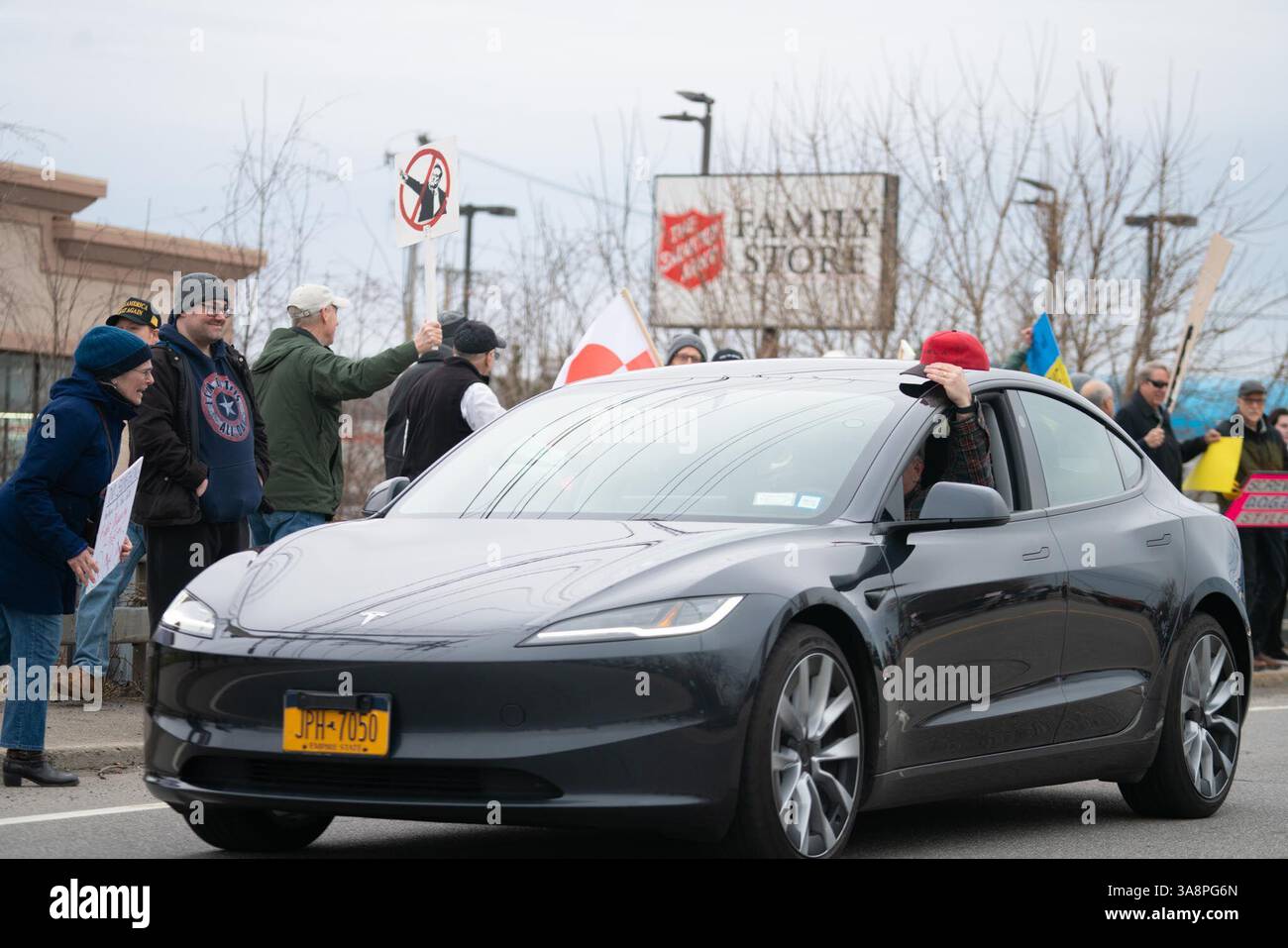 Protesters gather outside Tesla Showroom during the protest. A protest ...