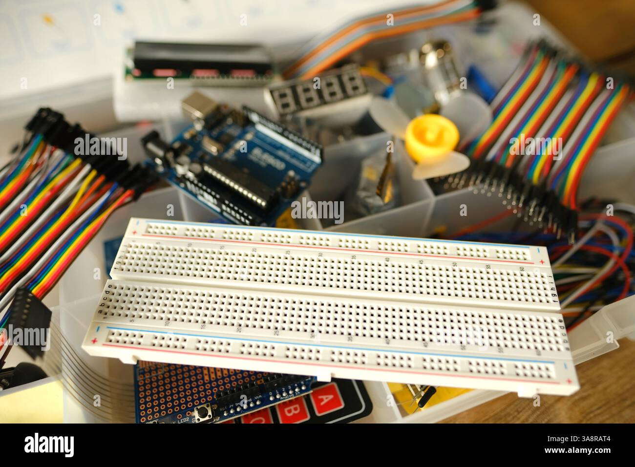 Electronics components, Breadboard in box with jumper wires and ...